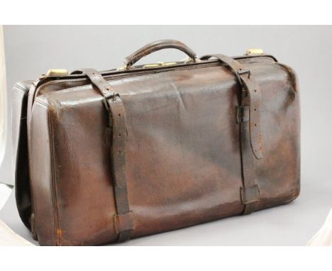 A Large Vintage French Leather Carrying Suitcase marked to inside 'Au Touriste, Paris'