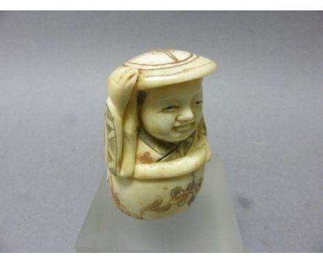 Signed Oxbone Netsuke of a Man holding Hat