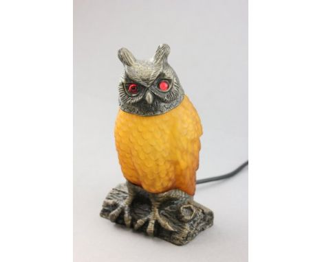 A Table Lamp in the form of an Owl with Amber Glass Body Shade