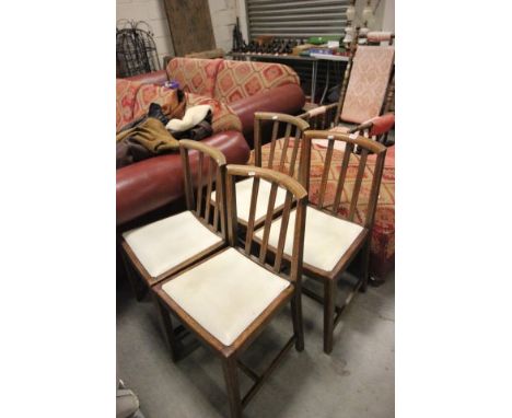 A Set of Four Oak Square Stick Back Dining Chairs 