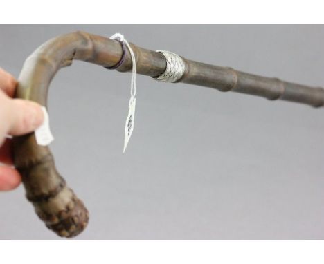 A Bamboo Walking Stick with woven silver band 