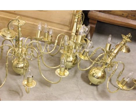 An Eight Branch Gilt Chandelier Light Fitting and a pair of similar five branch ones