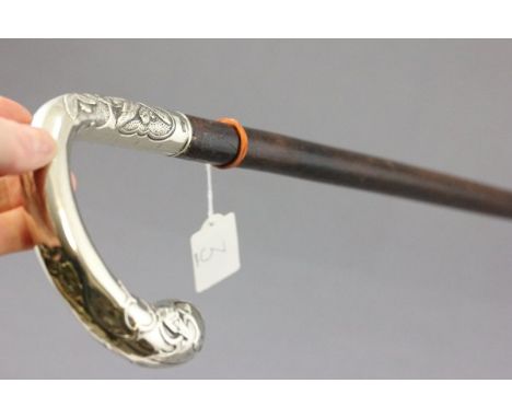 A Walking Stick with Nickel Silver Handle engraved with Flowers and Spaniels Heads