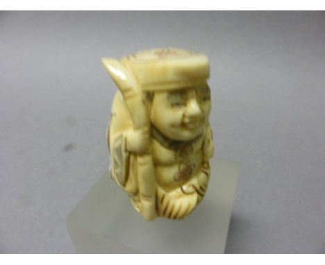 Signed Netsuke of a Man with Fish
