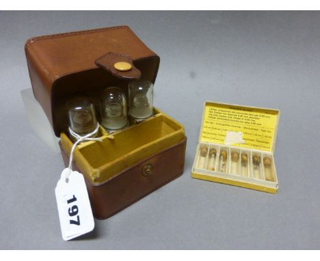 A Vintage Leather Cased Apothecary Set plus a box of additional tubes