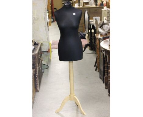 A Mannequin on wooden stand 