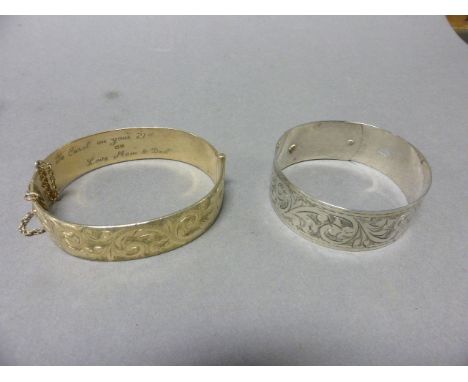 Silver Gilt Bangle with half foliate scroll engraving, Birmingham 1961 together with another Silver Bangle with full foliate 