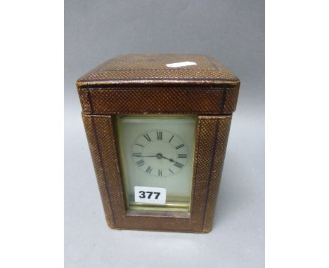 19th century Gilt Brass Carriage Clock with white enamel face and key in brown leather travelling case