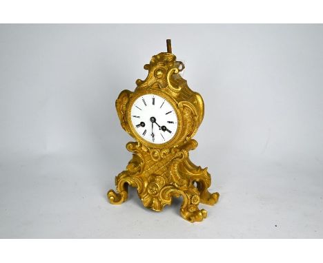 A French Rococo Revival gilt ormolu mantel clock, 19th century, the two train drum movement striking the hours and halfs on a