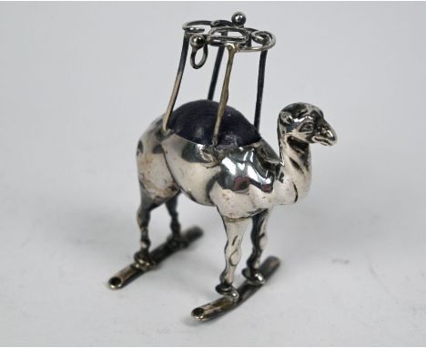 An Edwardian silver 'Camel' hatpin-cushion, Adie &amp; Lovekin Ltd, Birmingham 1906, 8cm highRear legs f/r
- the rear legs ar