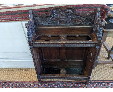 A Victorian gothic oak carved stick stand 69 cm x 23 cm x 97 cm h