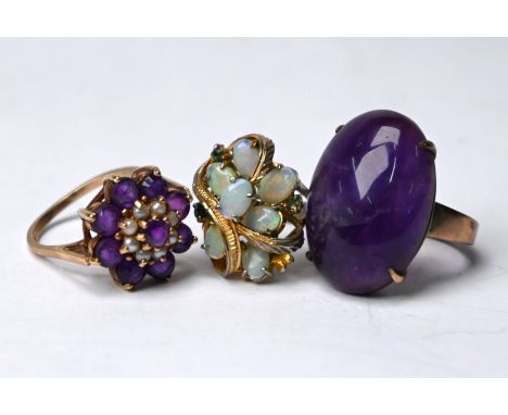 An amethyst and seed pearl cluster ring, 9ct yellow gold set, size Q; a yellow metal ring set large oval purple chalcedony, 2