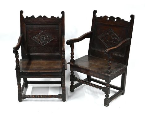 A companion pair of 17th/18th century oak chairs with carved lozenge backs over swept arms, raised on part bobbin turned fram