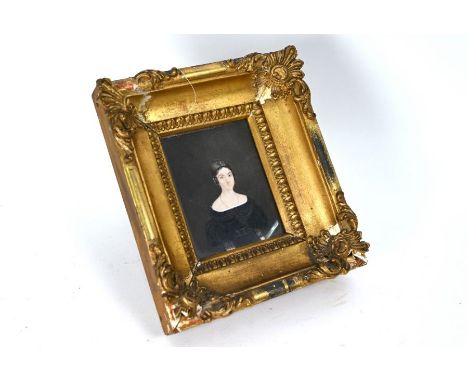 An early Victorian portrait miniature on ivory of a young lady in mourning dress, unsigned, 11 x 8.5 cm in heavy gilt gesso f