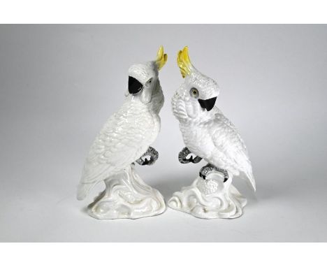 A pair of Crown Staffordshire cockatoos by J T Jones &amp; W R Tipton, 25 cm highOne with hairline crack through base