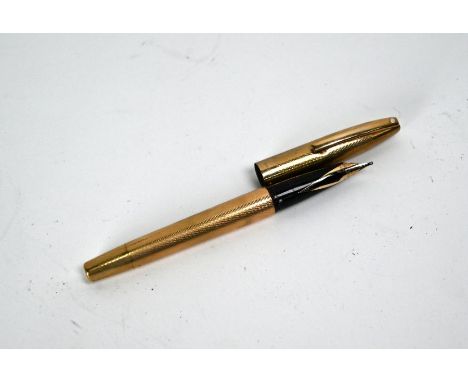 A 9ct gold Sheaffer Imperial fountain pen and 14k nib, the barrel London 1970Engine-turning worn but no apparent dents; not t