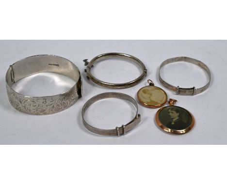 Charles Horner - A silver half hinged bangle with chased decoration and buckle type clasp, Chester 1947 to/w three silver chi
