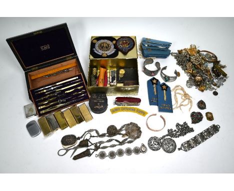 A base-metal filigree chatelaine to/w a quantity of costume jewellery, cased set of drawing instruments, cigarette lighters, 