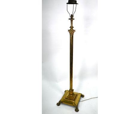 A late 19th century brass telescopic column oil lamp, on square base with cast paw feet (converted to electricity / no reserv