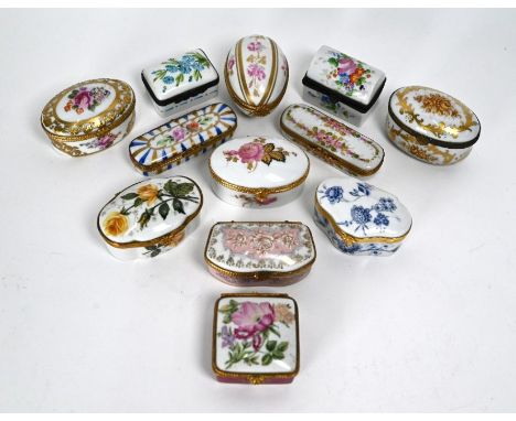 Twelve various Limoges and other china patch-boxes with floral painted/printed decoration