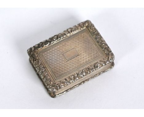 A William IV silver vinaigrette with floral-chased rim and engine-turned decoration, gilt interior with foliate-pierced grill