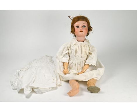A German MOA 200/9 bisque-headed girl doll with red wig, closing blue eyes and open mouth with four teeth, on jointed composi