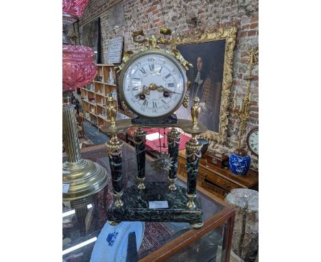 A French 8-day drum movement veined marble and ormolu portico mantel clock, circa 1900, the Paris stamped two train movement 