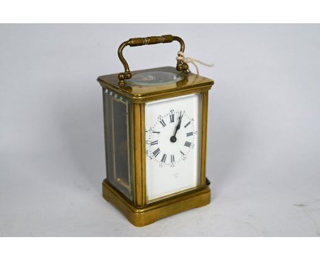 A late 19th century brass carriage clock with single train 8-day movement with white enamelled dial, indistinctly signed, 11.