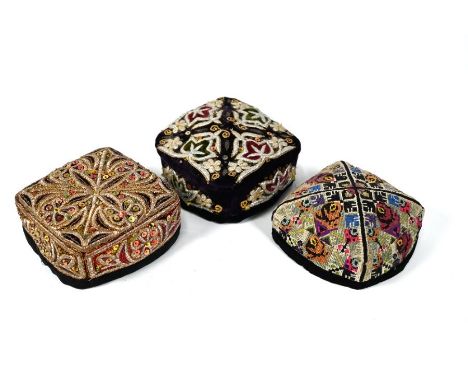 Three Uzbekistan Duppi/Tubeteka hats, two square-shaped richly embroidered with metalised threads and sequins, and one square