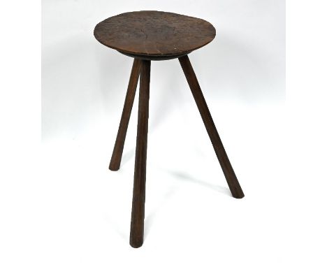 A pollard oak and oak&nbsp;cricket table, of primitive form, 18th century, with thick circular one piece top and raised on th