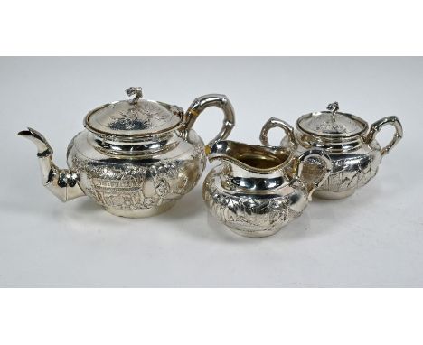 A late 19th/early 20th century Chinese export silver three piece tea service by Wang Hing &amp; Co, Hong Kong, comprising tea