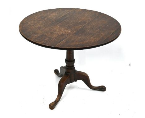 An 18th century oak birdcage tilt top tripod table, on pad feet 90 cm dia. x 72 cm h