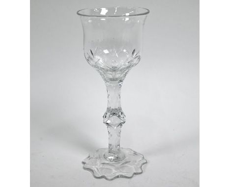 A late Georgian Irish (probably) cut wine glass with ogee bowl on facet-cut hexagonal stem and lobed foot, 19.5 cmGood condit