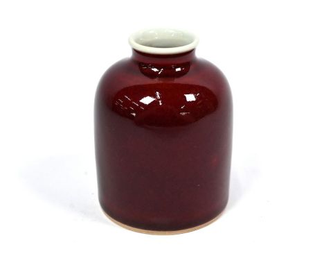 A Chinese Langyao or sang de boeuf monochrome water pot with rich raspberry red glaze and contrasting white interior and base