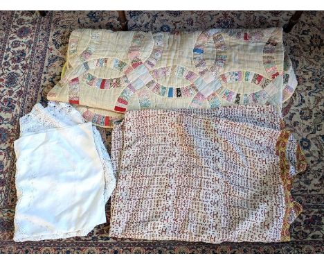 A vintage French hand-sewn bed cover/quilt, pale yellow/cream ground with patchwork decoration and scallop-shaped edging, 2.7