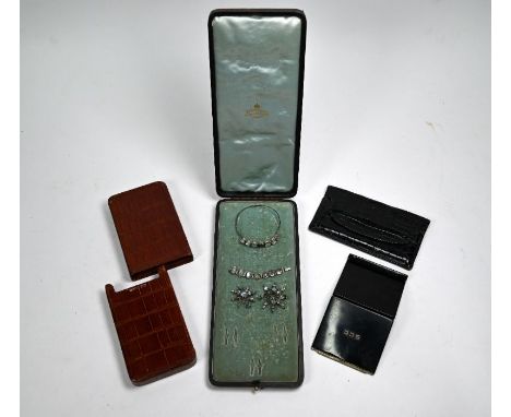 A French Art Deco enamelled gilt metal cigarette case to/w a suite of costume jewellery set with moonstones a/f, vintage silk