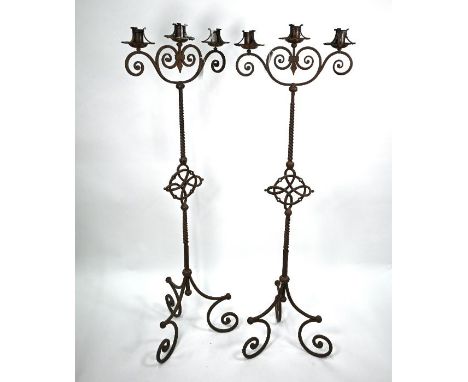 A pair of heavy wrought iron three candle tripod stands in the 17th century style 151 cm h o/a (2)No damage or losses