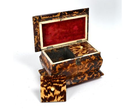 A 19th century tortoiseshell tea caddy of sarcophagus form, with two lidded compartments, on vegetable ivory bun feet 14 x 17