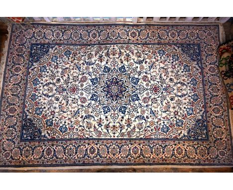 A Persian Nain carpet, the traditional floral vine design on off-white ground, 312 cm x 198 cm