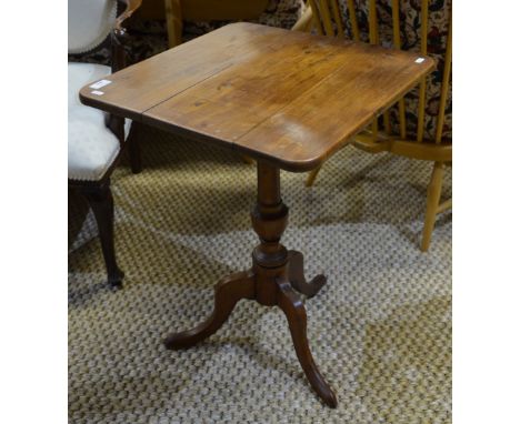 A 19th century fruitwood tripod table, probably Maltese, the three plank tilt top raised on a turned support to sabre legs, 4