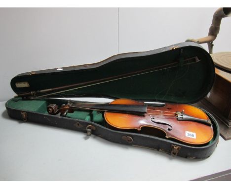 A Violin, with one piece back with bow in black case (bearing label A. Stradivarius).