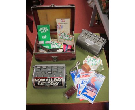 Two Bus Ticket Machines, a ticket punch, bus tickets among associated items.