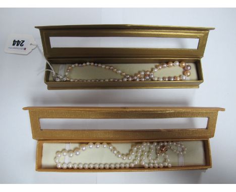 A Modern Graduated Single Strand Pearl Bead Necklace, to snap clasp stamped "925", inset to the centre; Together with A Moder