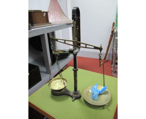 A Late Victorian Cast iron Set of Balance Scales, scroll, knop and twist support, gilt highlights, brass pans and weights. 