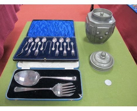 An Arts & Crafts Silver Plated Dessert Cutlery Set, Witness fruit servers (both cased) 'Yih Tai Chung Changsha' tea caddy.