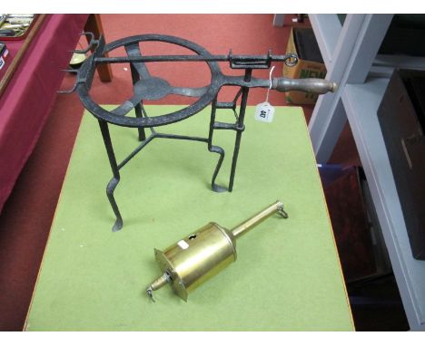 A XIX Century Cast Iron Range/Fire Side Tripod Vessel Stand, with applied swing meat, and a Salter brass roasting jack. (2)