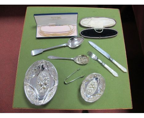 A Decorative Mother of Pearl Handled Knife and Fork, each with textured ferrule and engraved scroll detail; a Fiddle pattern 