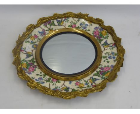 A Decorative Royal Staffordshire Ceramic Plaque, mounted to a circular mirror, painted with garden birds and garlands of rose