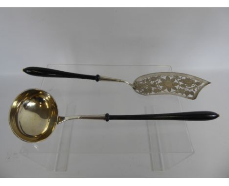 An Antique Silver Fish Slice, pierced decoration with ebony handle and ivory finial, approx 38 cms together with a ladle ebon