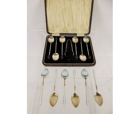 A Set of Gilt Silver and Enamel Coffee Spoons, beautifully enamelled with floral spray together with a set of bean finial cof